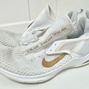 Nike White and Gold Sneakers with React Foam.  Fits like a 7 but is a size 8